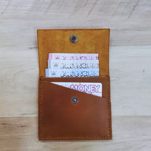 Handmade all-natural leather wallet designed to fit money and cards