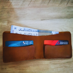Handmade all-natural leather wallet designed to fit money, and cards.