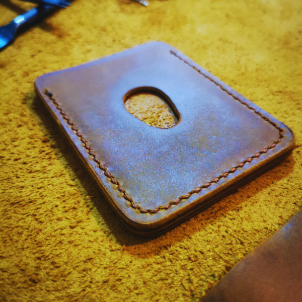 Handmade all-natural leather wallet designed to fit money and cards.