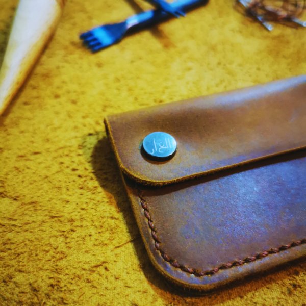 Handmade all-natural leather wallet designed to fit money and cards.