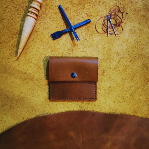 Handmade all-natural leather wallet designed to fit money and cards