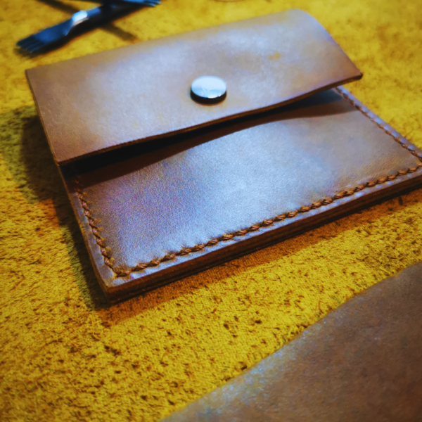 Handmade all-natural leather wallet designed to fit money and cards