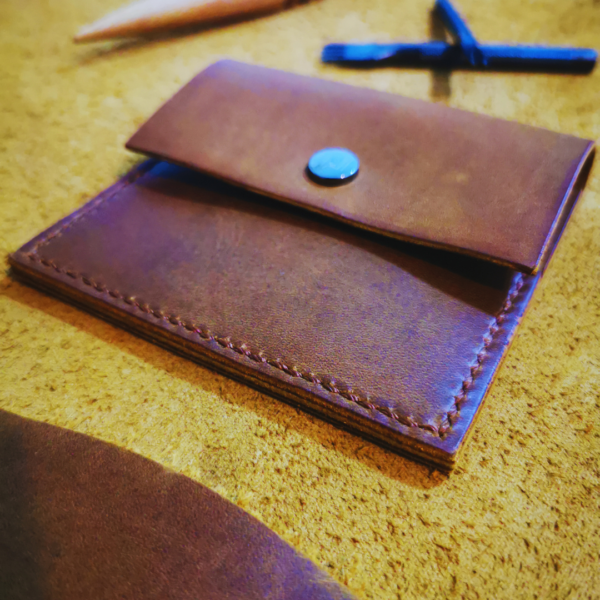 Handmade all-natural leather wallet designed to fit money and cards