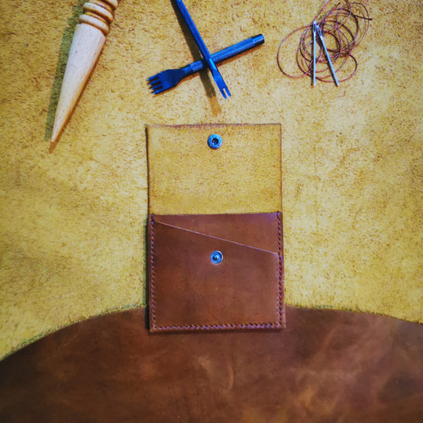 Handmade all-natural leather wallet designed to fit money and cards
