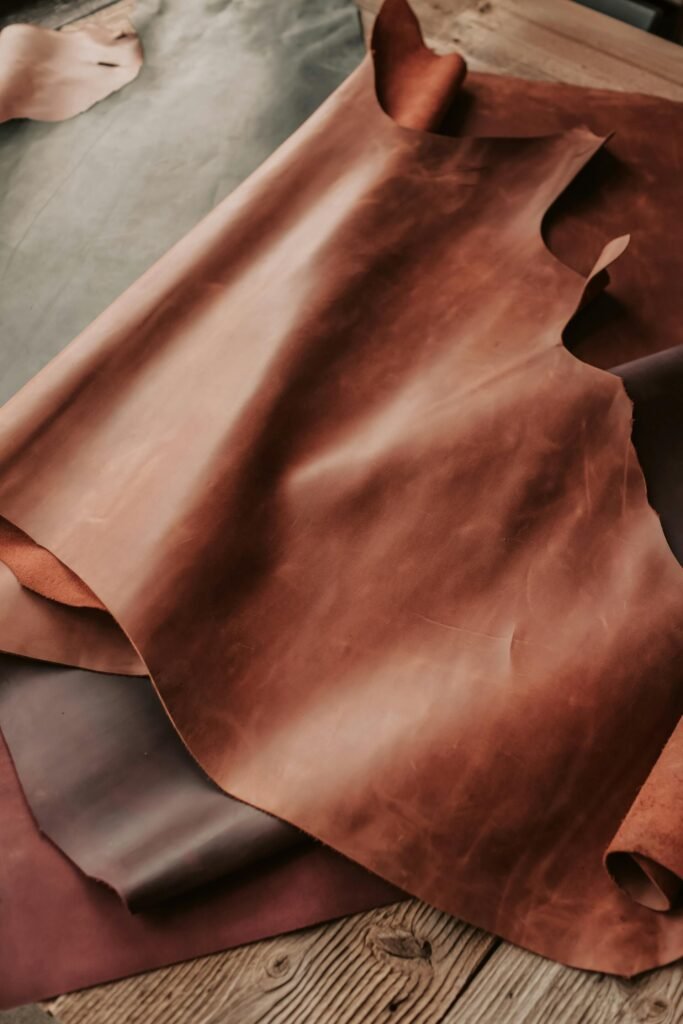 High-quality brown leather sheets displayed in a crafting workshop. About Al-Ghar. High-quality brown leather sheets displayed in a crafting workshop. About Al-Ghar.