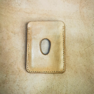Handmade all-natural leather wallet designed to fit money and cards.