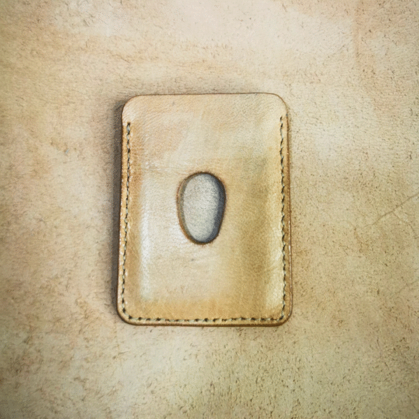 Handmade all-natural leather wallet designed to fit money and cards.