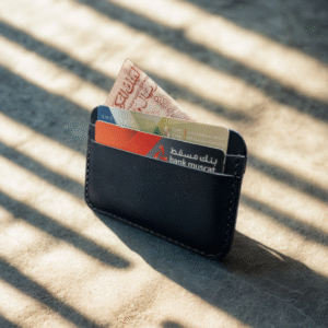 Handmade black vachetta leather wallet with black stitching, 5-pocket design.