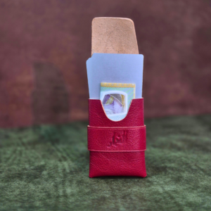 Front angle view of a 9x6cm red leather minimalist fold wallet showcasing its ultra-slim profile.